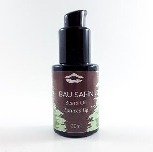 Bottle of spruced up beard oil against white background